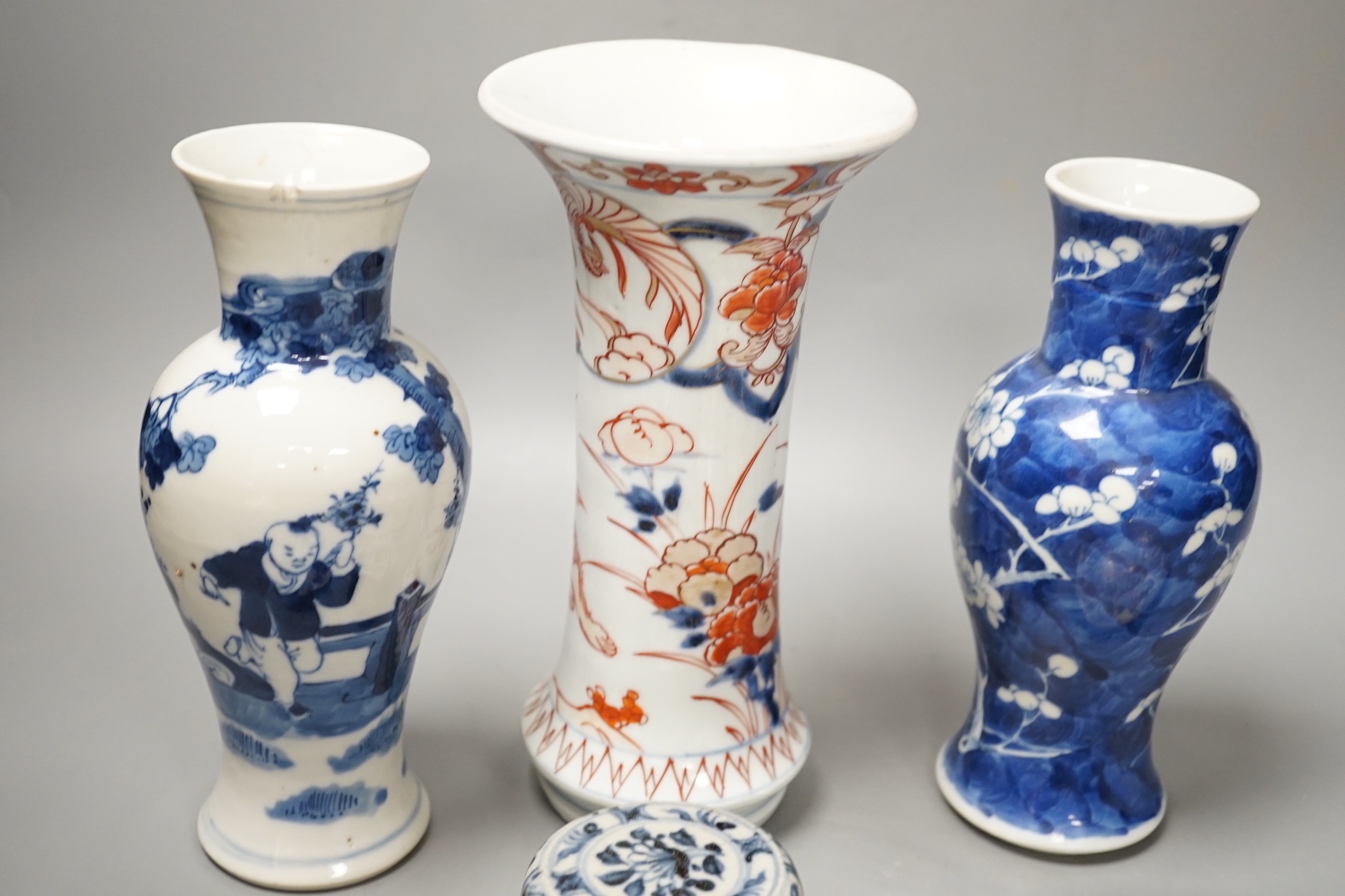 A Japanese Edo period Imari vase, 22. 5 cm, two 19th-century Chinese blue and white baluster vases, an Annamese blue and white box and cover, a Chinese famille rose plates and a blue and white dish